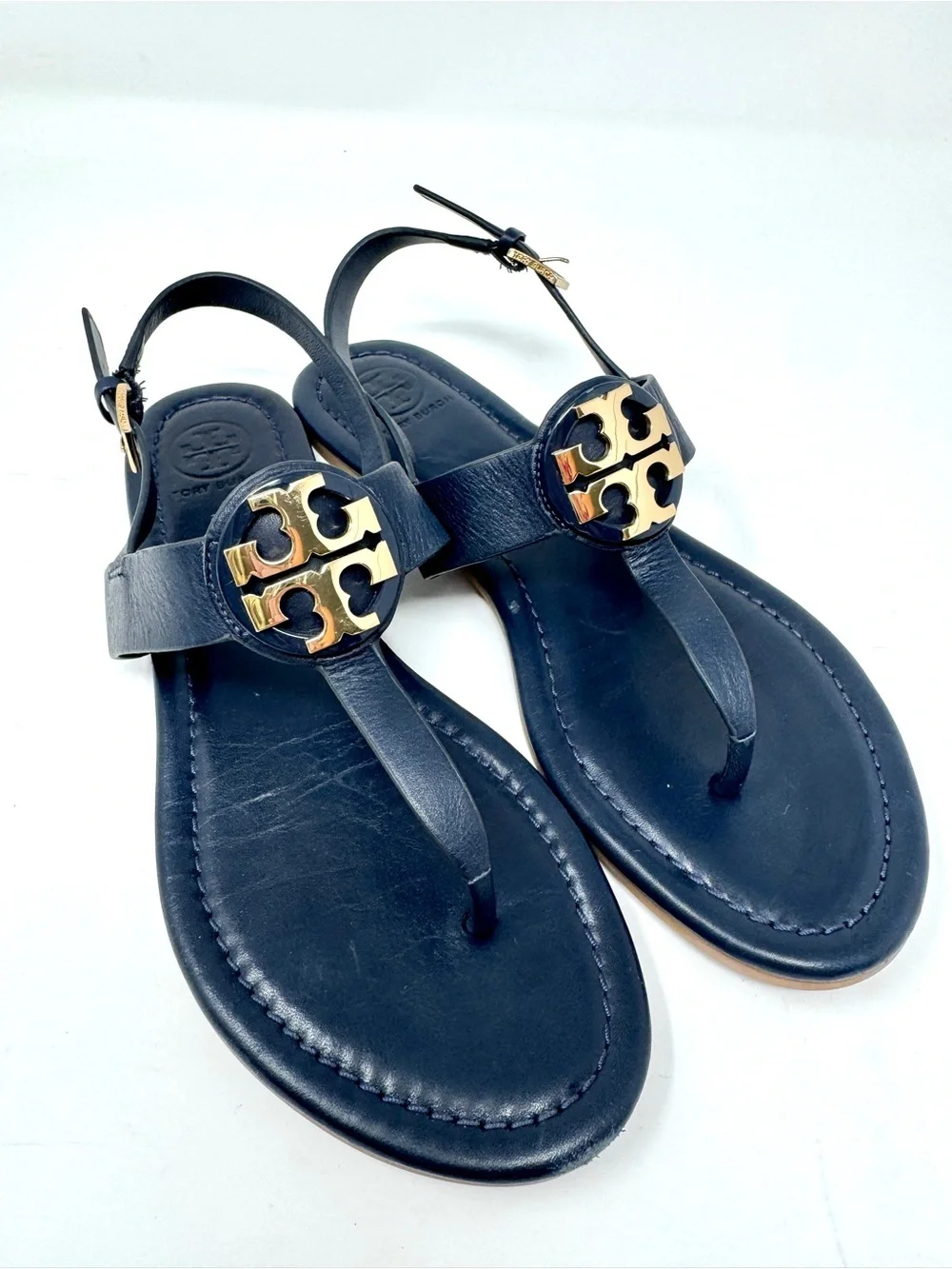 Tory Burch Bryce Navy Leather Logo Thong Sandals with Gold Logo Medallions